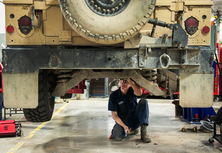 Senior Airman Connor Atwood, 341st Logistics Readiness Squadron vehicle maintenance journeyman, examines the underside of a Humvee June 11, 2019, at Malmstrom Air Force Base, Mont.