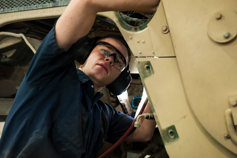 Senior Airman Connor Atwood, 341st Logistics Readiness Squadron vehicle maintenance journeyman, flushes the air conditioning system of a Humvee June 11, 2019, at Malmstrom Air Force Base, Mont.