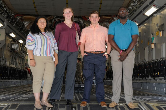 Left to right: Rachel Higgins, Emma McBride, Aleric Stell and Brandon Harvey, participants in the new Summer Intern Program, stand on the ramp of a C-17 Globemaster III during a tour of Joint Base Charleston, S.C., June 10, 2019.