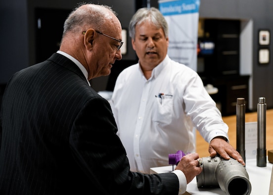 Retired Col. Joe Zeis, the Senior Advisor for Aerospace and Defense for the Ohio Governor’s Office, inspects a T-pipe, used in 910th aerial spray missions, during a tour of America Makes, June 13, 2019.