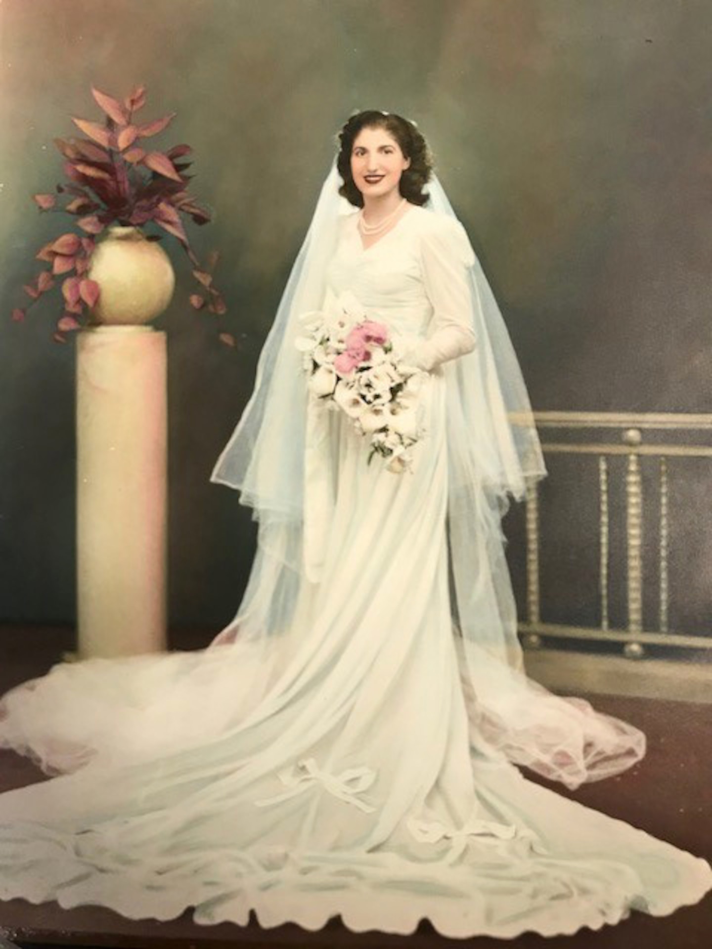 Aida Bonsonto wears a wedding dress, circa 1946, made from a parachute, that was sent home to her by Army medic Gerald “Jerry” Bonsonto who served with the 82nd Airborne Division during World War II.