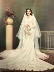 Aida Bonsonto wears a wedding dress, circa 1946, made from a parachute, that was sent home to her by Army medic Gerald “Jerry” Bonsonto who served with the 82nd Airborne Division during World War II.