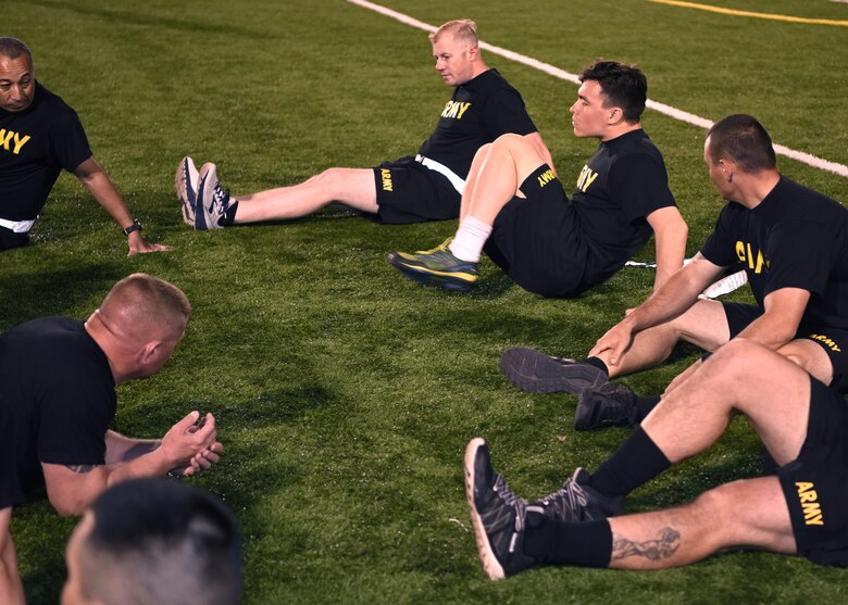 U.S. Army Soldiers perform crunch kicks during the Army’s Birthday PT Challenge at the Mathis Fitness Center on Goodfellow Air Force Base, Texas, June 14, 2019. The teams took turns doing as many repetitions as they could during the allotted time. (U.S. Air Force photo by Airman 1st Class Ethan Sherwood/Released)