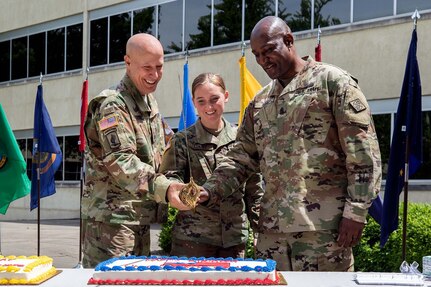 Maj. Gen. David C. Coburn, U.S. Army Financial Management Command commanding general, left; Spc. Kayla Adkins, 384th Military Police Company, center; and Command Sgt. Maj. Courtney Ross, USAFMCOM command sergeant major, cut a birthday cake during a ceremony celebrating both the 244th Army birthday and the 244th birthday of the Army Finance Corps at the Maj. Gen. Emmett J. Bean Federal Center in Indianapolis June 14, 2019. It is an Army tradition that the youngest Soldier available at an Army birthday celebration help the commander and sergeant major cut a cake, and Adkins was the youngest at 22 years old. (U.S. Army photo by Mark R. W. Orders-Woempner)