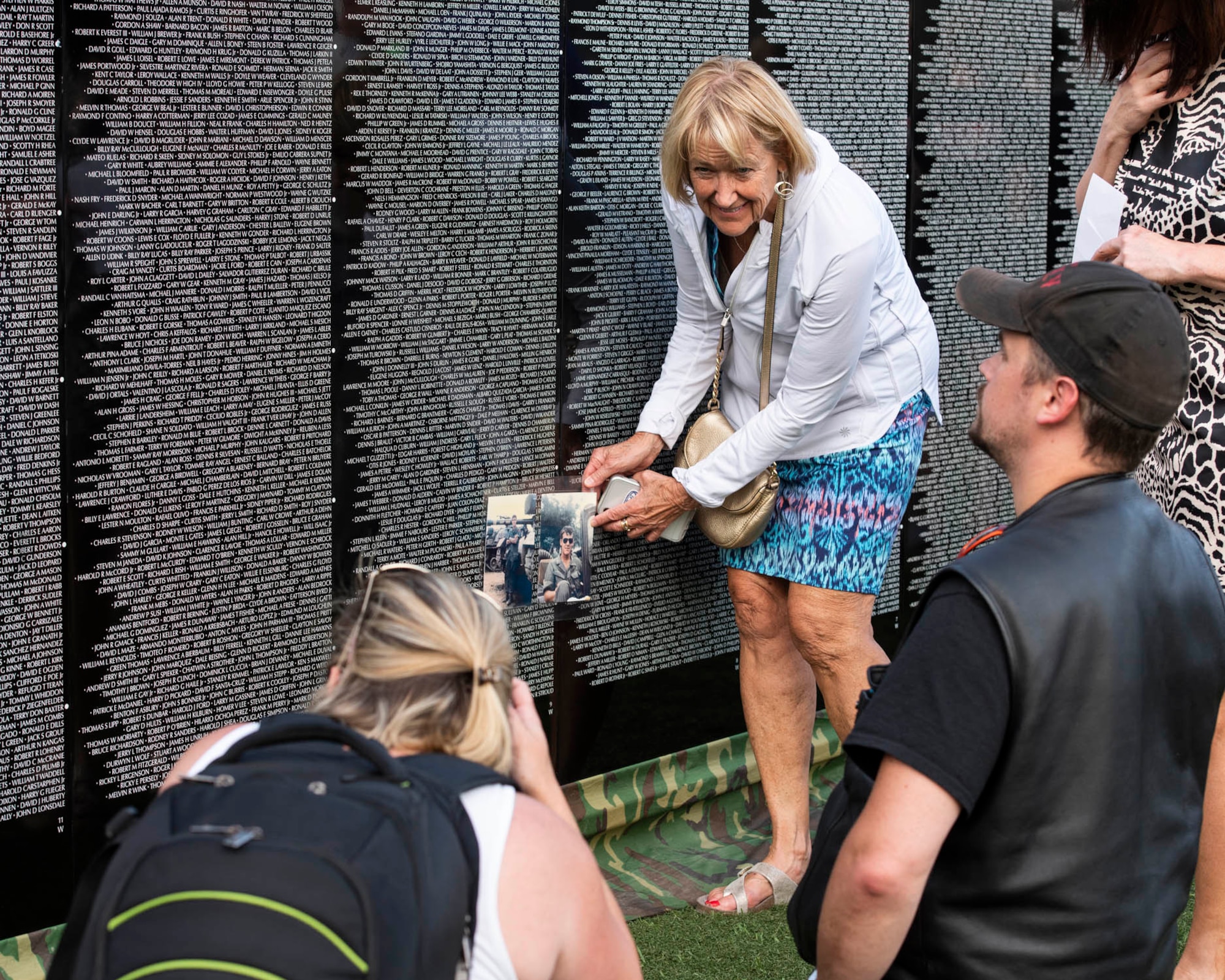 Visitors of “The Moving Wall,” a half-size replica of the Vietnam Memorial that stands in Washington D.C., search for names of loved ones, friends, and comrades lost on the Vietnam War following the opening ceremony of the wall June 13, 2019 in Medical Lake, Wash. Visitors can view the display 24 hours a day at the 200 block of South Prentis St. in Medical Lake. (U.S. Air National Guard photo by Staff Sgt. Rose M. Lust/Released)