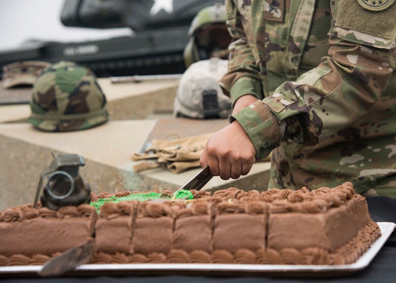 U.S. Army Sergeant Amelia Roman, Gold Coast recruiter, cuts the cake during an Army Birthday celebration June 14, 2019, at Vandenberg Air Force Base, Calif. As part of tradition, one of the oldest and youngest soldiers cut the cake during the annual event. (U.S. Air Force photo by Airman 1st Class Aubree Milks)