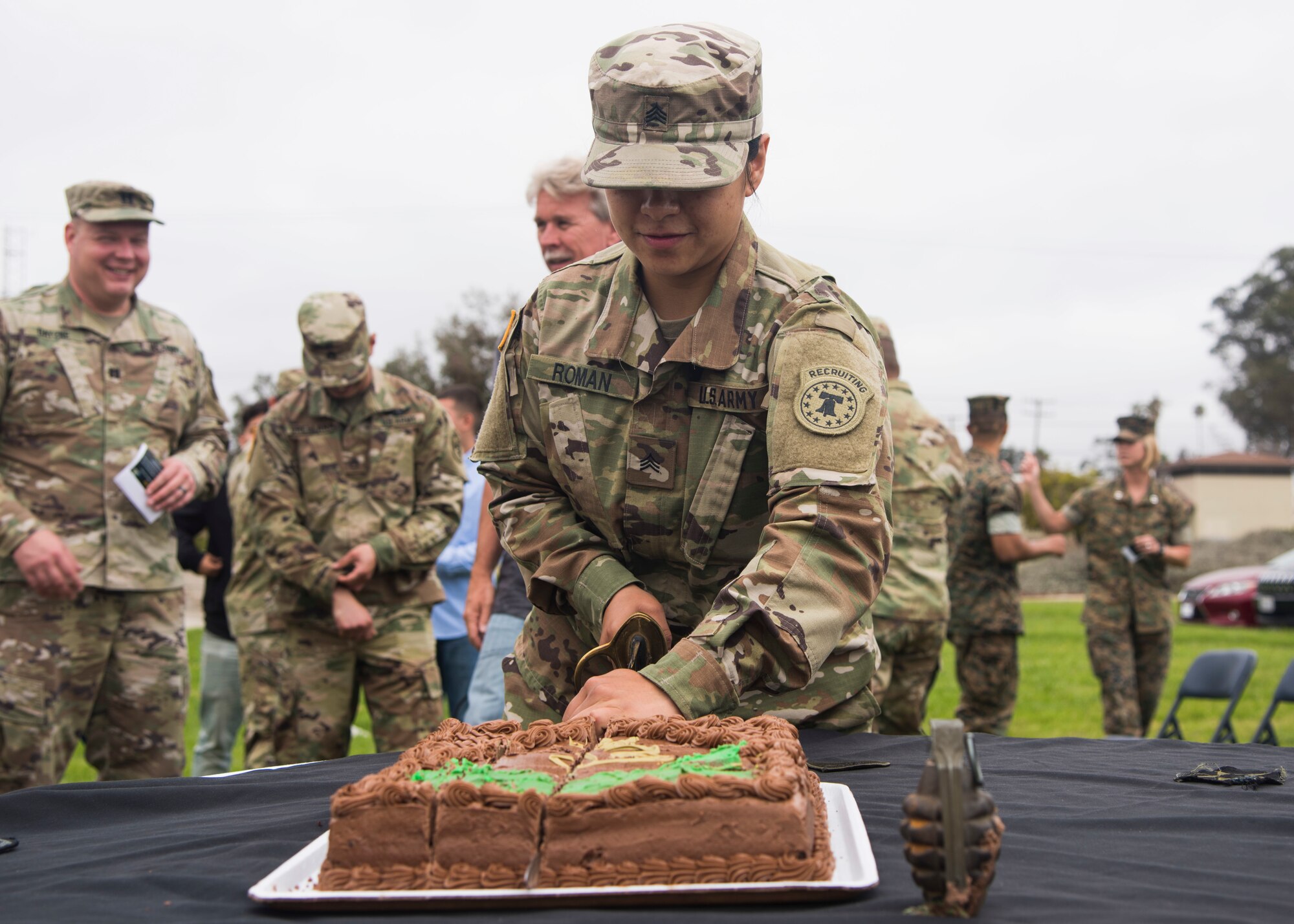U.S. Army Sergeant Amelia Roman, Gold Coast recruiter, cuts the cake during an Army Birthday celebration June 14, 2019, at Vandenberg Air Force Base, Calif. As part of tradition, one of the oldest and youngest soldiers cut the cake during the annual event. (U.S. Air Force photo by Airman 1st Class Aubree Milks)