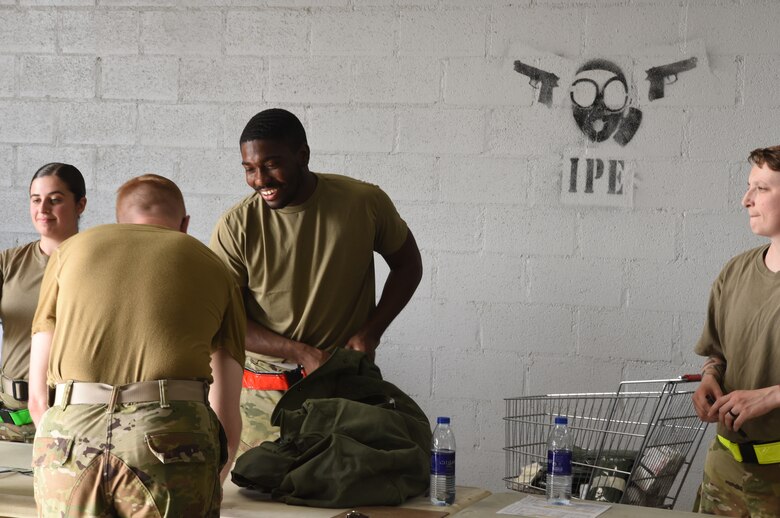Members of the 380th Air Expeditionary Wing participate in an individual protective equipment issue exercise May 29, 2019, on Al Dhafra Air Base, United Arab Emirates.