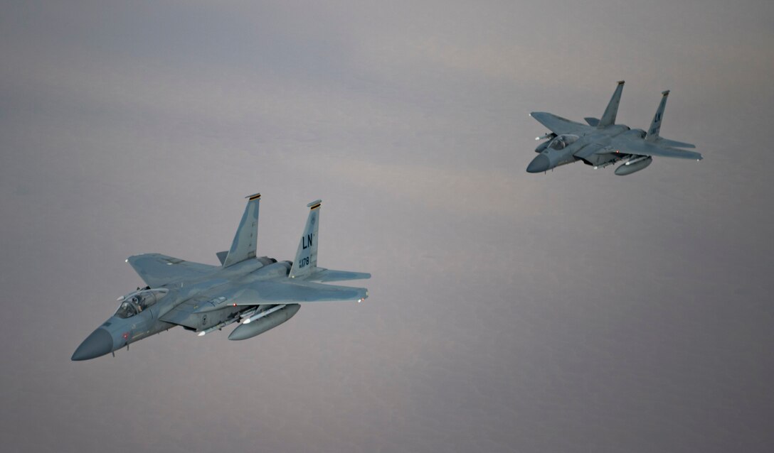 A photo of US and Saudi Air Forces F-15 flying together.