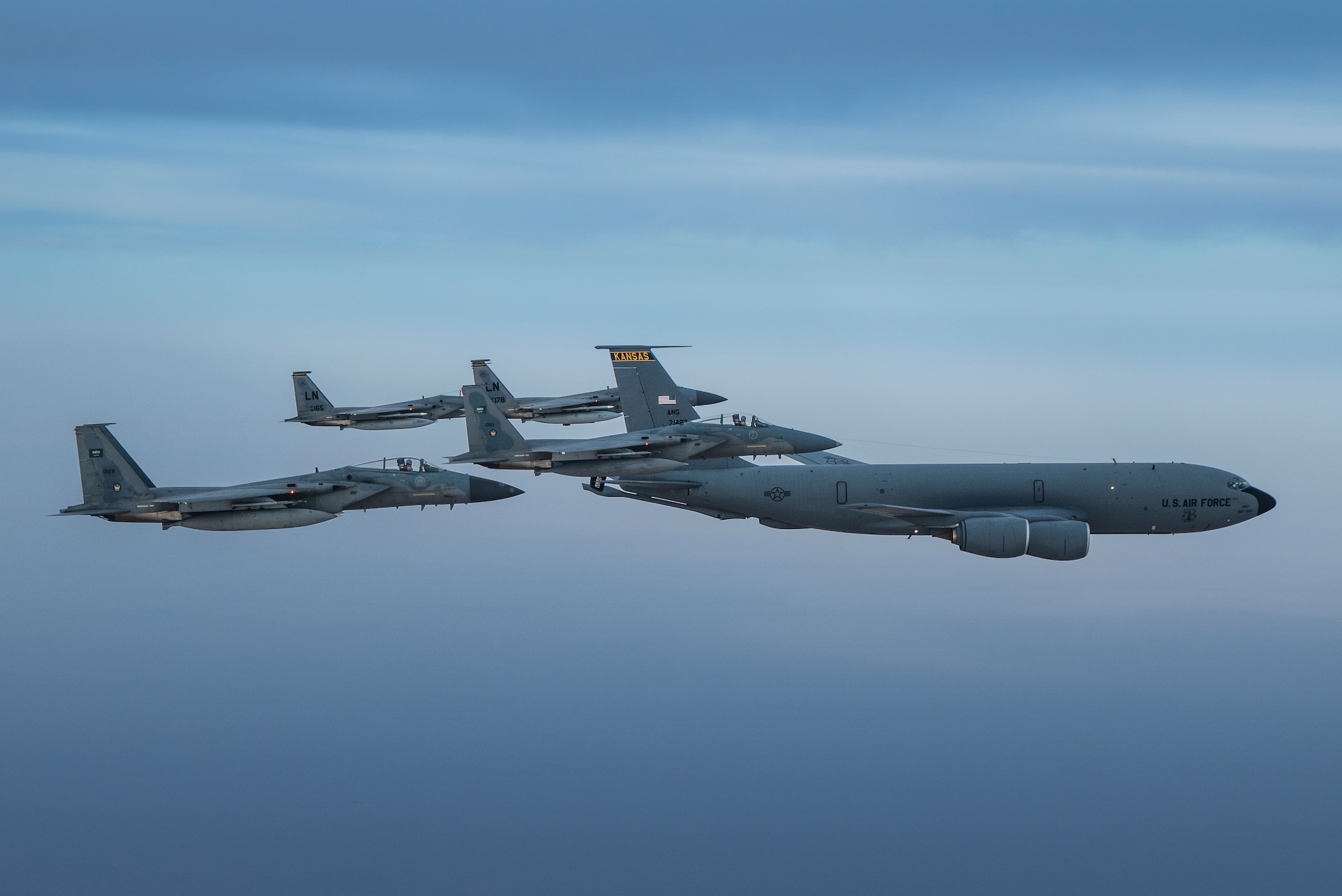 A photo of US and Saudi Air Force F-15Cs flying together in formation