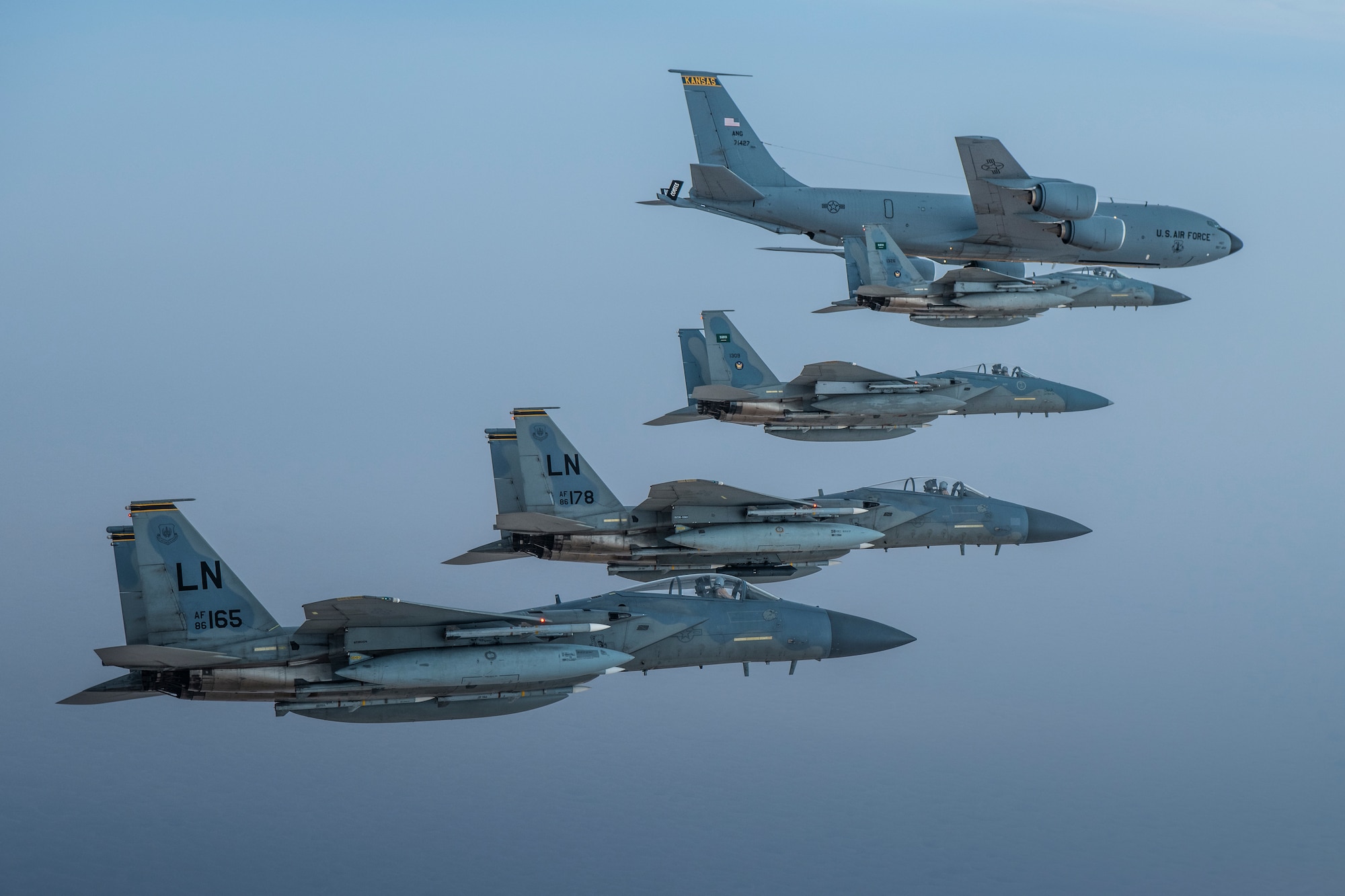 A photo of US and Saudi Air Force F-15Cs flying together in formation