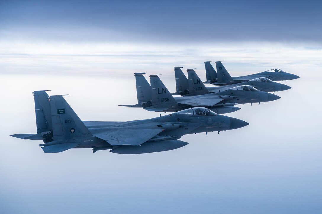 A photo of US and Saudi Air Force F-15Cs flying together in formation
