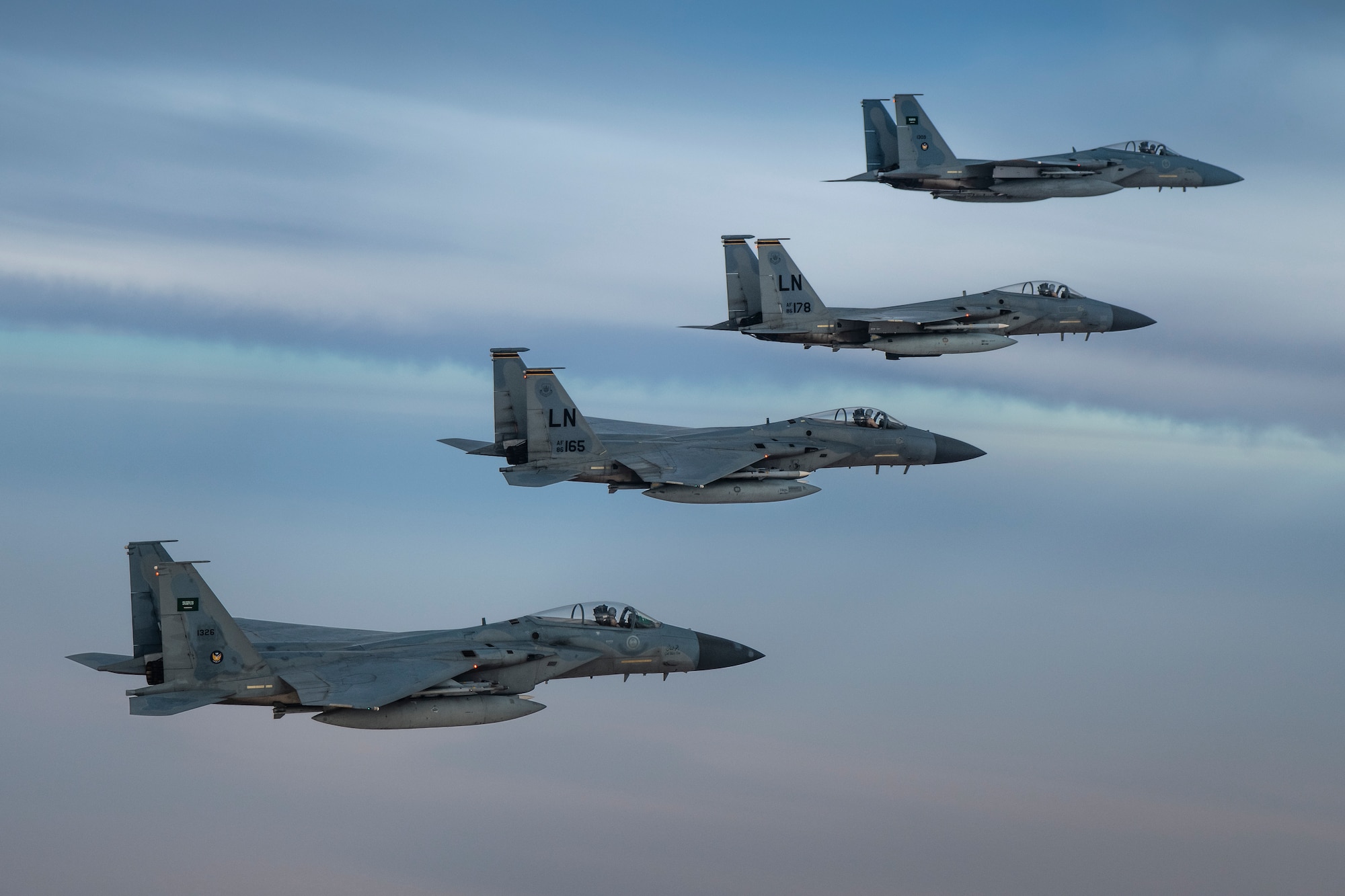 A photo of US and Saudi Air Force F-15Cs flying together in formation