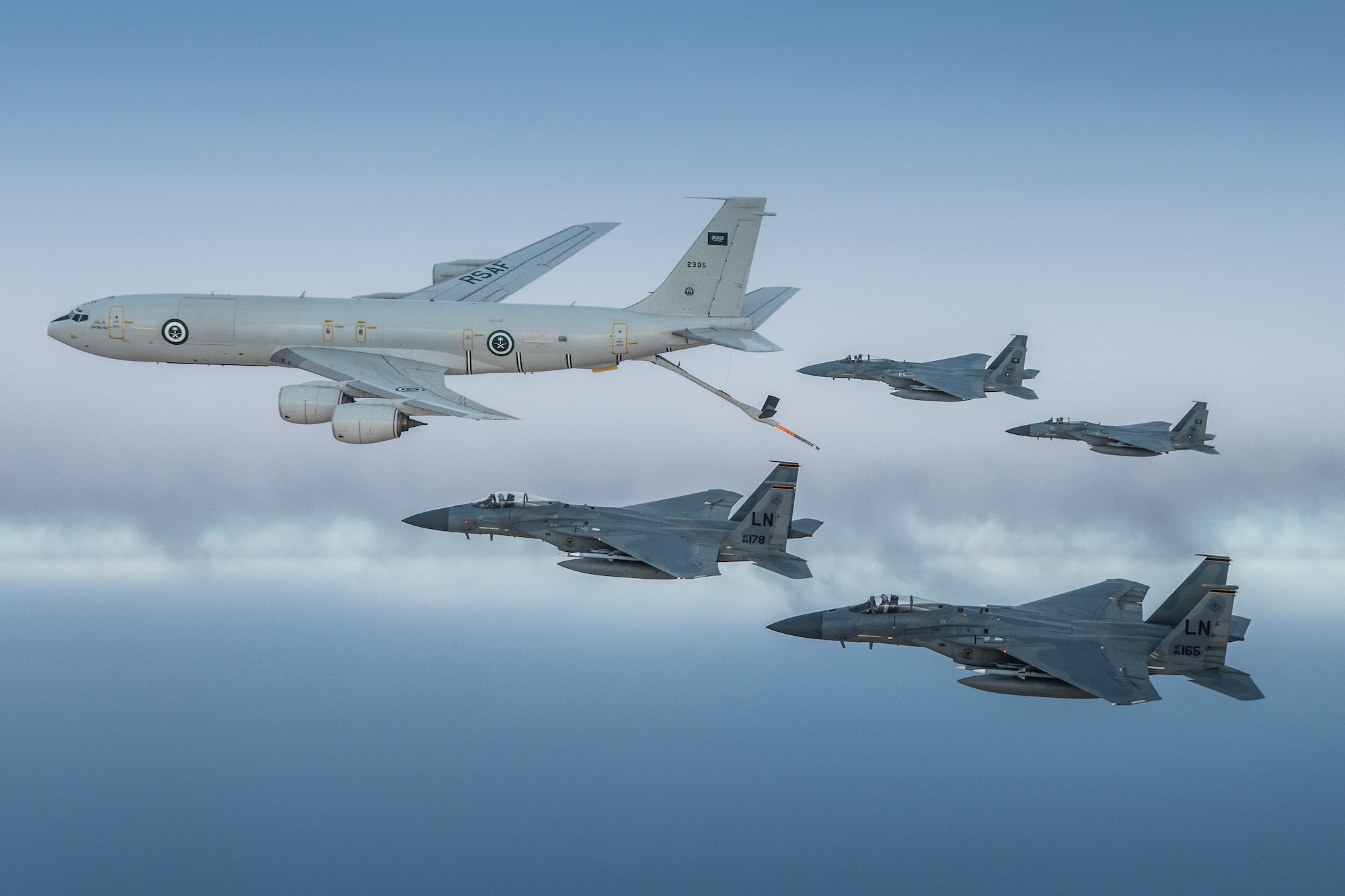 A photo of US and Saudi Air Force F-15Cs flying together in formation