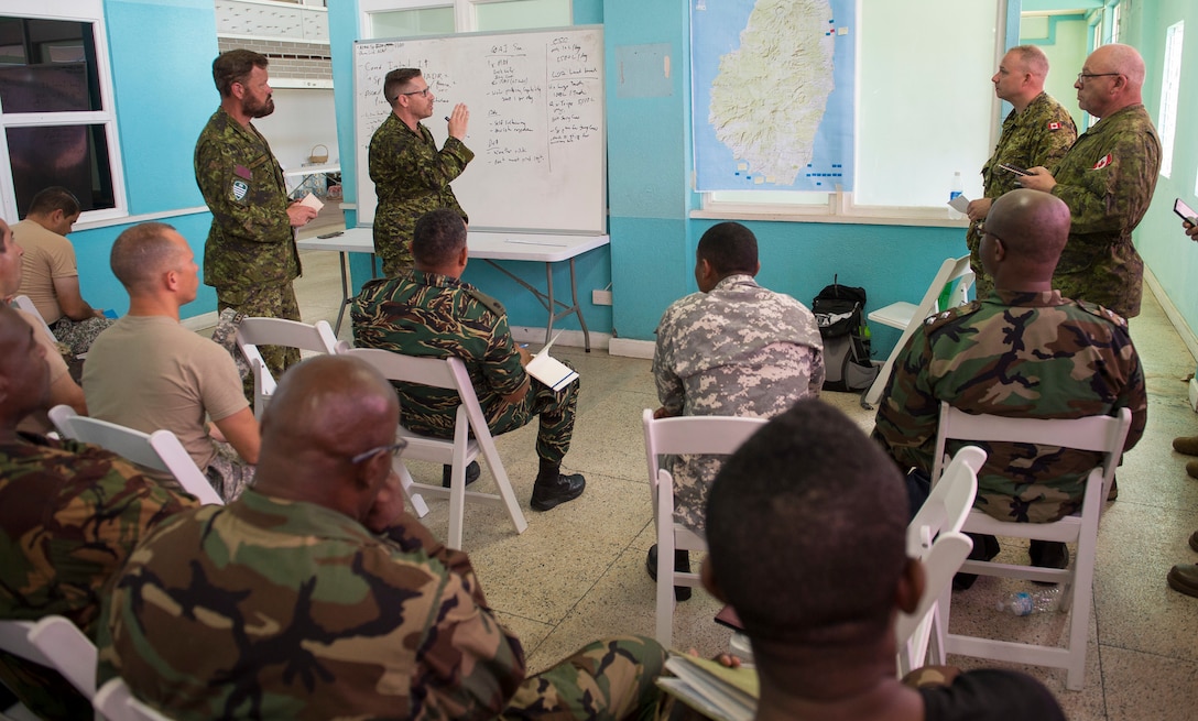 Canadian Armed Forces mentors and instructors conduct a demonstration.