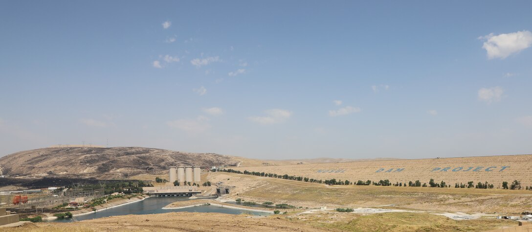 The Mosul Dam, with its the hydropower plant and four water storage towers, sits in a valley along the Tigris River approximately 30 miles outside Mosul City in Iraq. The dam is the largest in Iraq, and the fourth largest in the Middle East. It supplies water, hydropower, irrigation and flood control to the region.