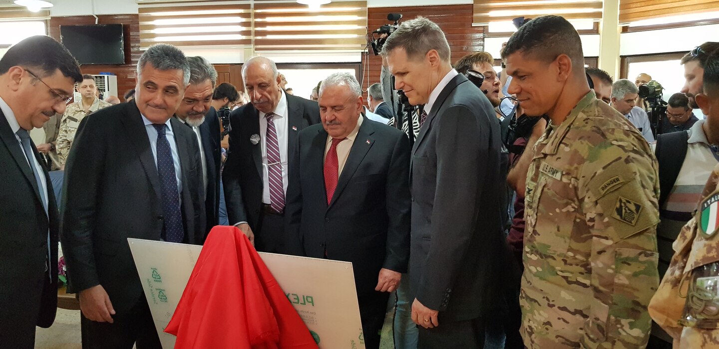 Distinguished guests view the new plaque that will hang at the Iraqi Ministry of Water Resources building commemorating the 3-year partnership between the three countries. The plaque was unveiled during a ceremony on June 15, 2019, in Mosul Iraq. Pictured left to right are: Iraq Ministry of Water Resources Director General of Dams and Reservoirs Mahdi Rashid; Italian Ambassador to Iraq Bruno Pasquino; Trevi S.p.A Chief Executive Officer Stefano Trevisani; Mosul Dam Project Manager Riyadh Ali; Iraq Minister of Water Resources Jamal Abbas al-Adili; U.S. Ambassador to Iraq Matthew H. Tueller; and, U.S. Army Corps of Engineers Transatlantic Division Commander Col. Mark Quander. 

The Mosul Dam Project started in 2016 as a joint project among the Iraq Ministry of Water Resources, the U.S. Army Corps of Engineers, and Italian Company Trevi S.p.A. in an effort to stabilize the infrastructure of the Mosul Dam. The Dam, which is the largest in Iraq, and the fourth largest in the Middle East, supplies water, hydropower, irrigation and flood control to the region.