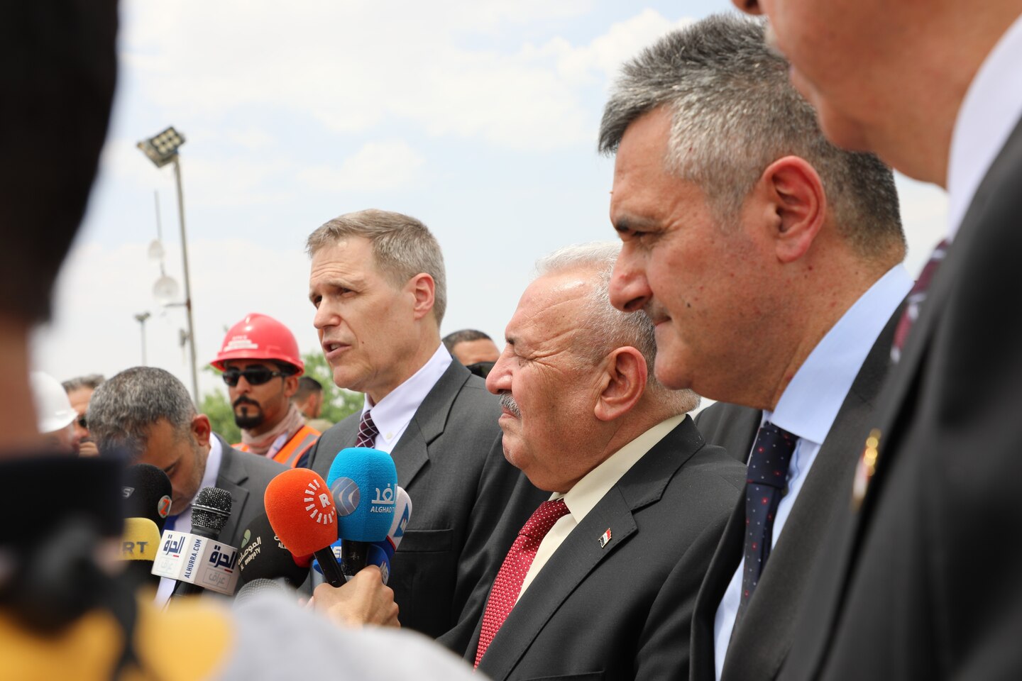 The U.S. Ambassador to Iraq, Matthew Tueller, speaks to media following a ceremony June 15, 2019, at the Mosul Dam in Iraq. Also picture are Iraq Minister of Water Resources Jamal Abbas al-Adili, and Italian Ambassador to Iraq Bruno Pasquino. The ceremony was held to commemorate the completion of USACE's work supporting the Mosul Dam Project. The Mosul Dam Project started in 2016 as a joint project among the Iraq Ministry of Water Resources, USACE, and Italian Company Trevi S.p.A. in an effort to stabilize the infrastructure of the Mosul Dam. The dam, which is the largest in Iraq, and the fourth largest in the Middle East, supplies water, hydropower, irrigation and flood control to the region. USACE's Mosul Dam Task Force acted as "The Engineer" for the joint endeavor.