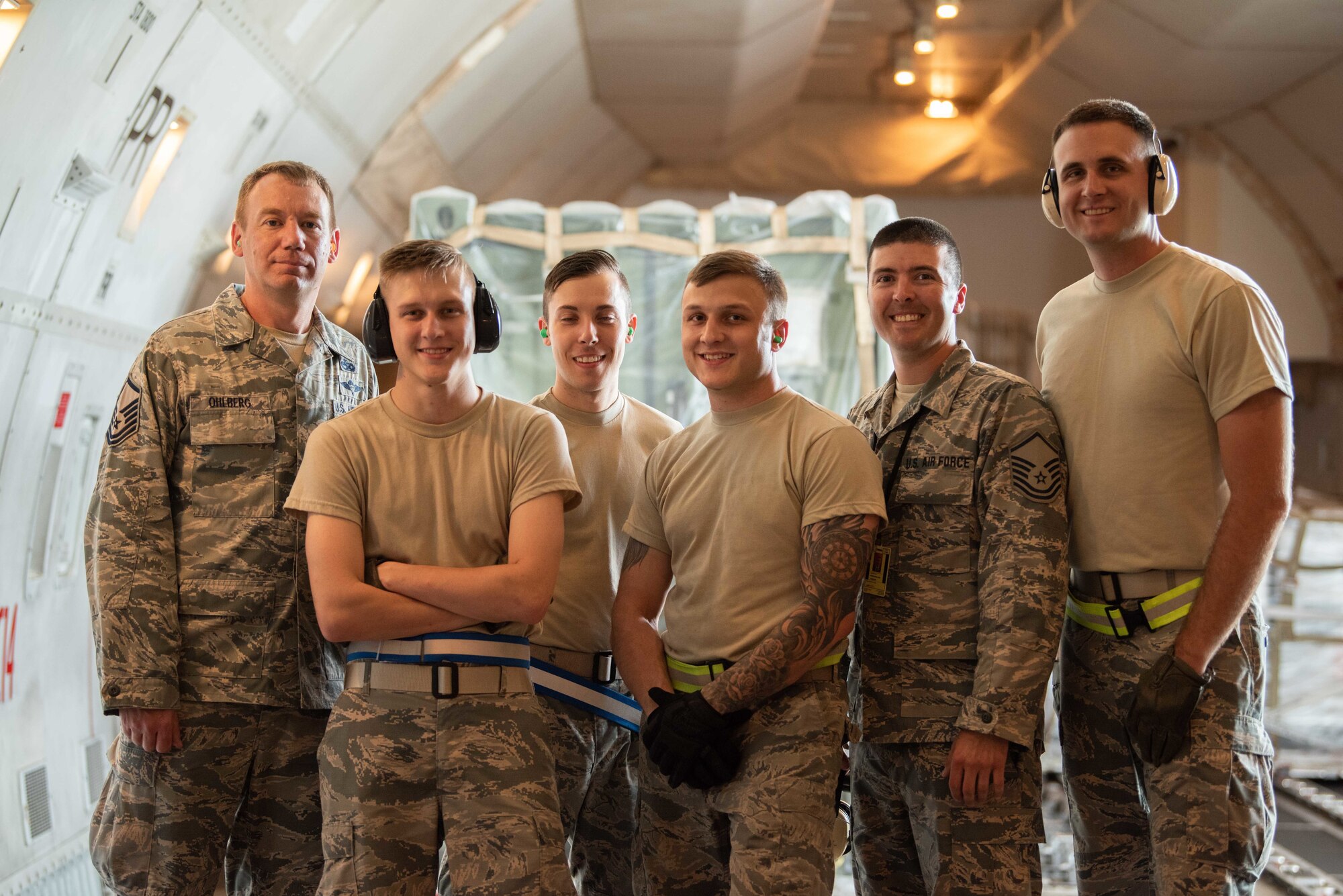 U.S. Air Force Airmen assigned to the 139th Logistics Readiness Squadron pose for a photo on a Boeing 747 during annual field training June 11, 2019, at Kadena Air Base, Japan. As an Air National Gaurd unit, the 139th LRS maintains a capable, ready force to support aerial port operations for both Federal and state mission sets. (U.S. Air Force photo by Senior Airman Kristan Campbell)