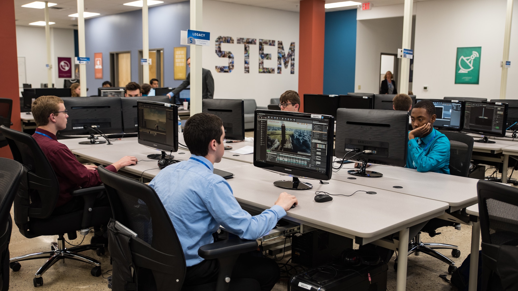 Air Force Research Laboratory Legacy interns work on their projects in the new Gaming Research Integration and Learning Laboratory (GRILL) space prior to the ribbon-cutting ceremony June 7 at the Dayton Regional STEM School. (U.S. Air Force photo/Richard Eldridge)