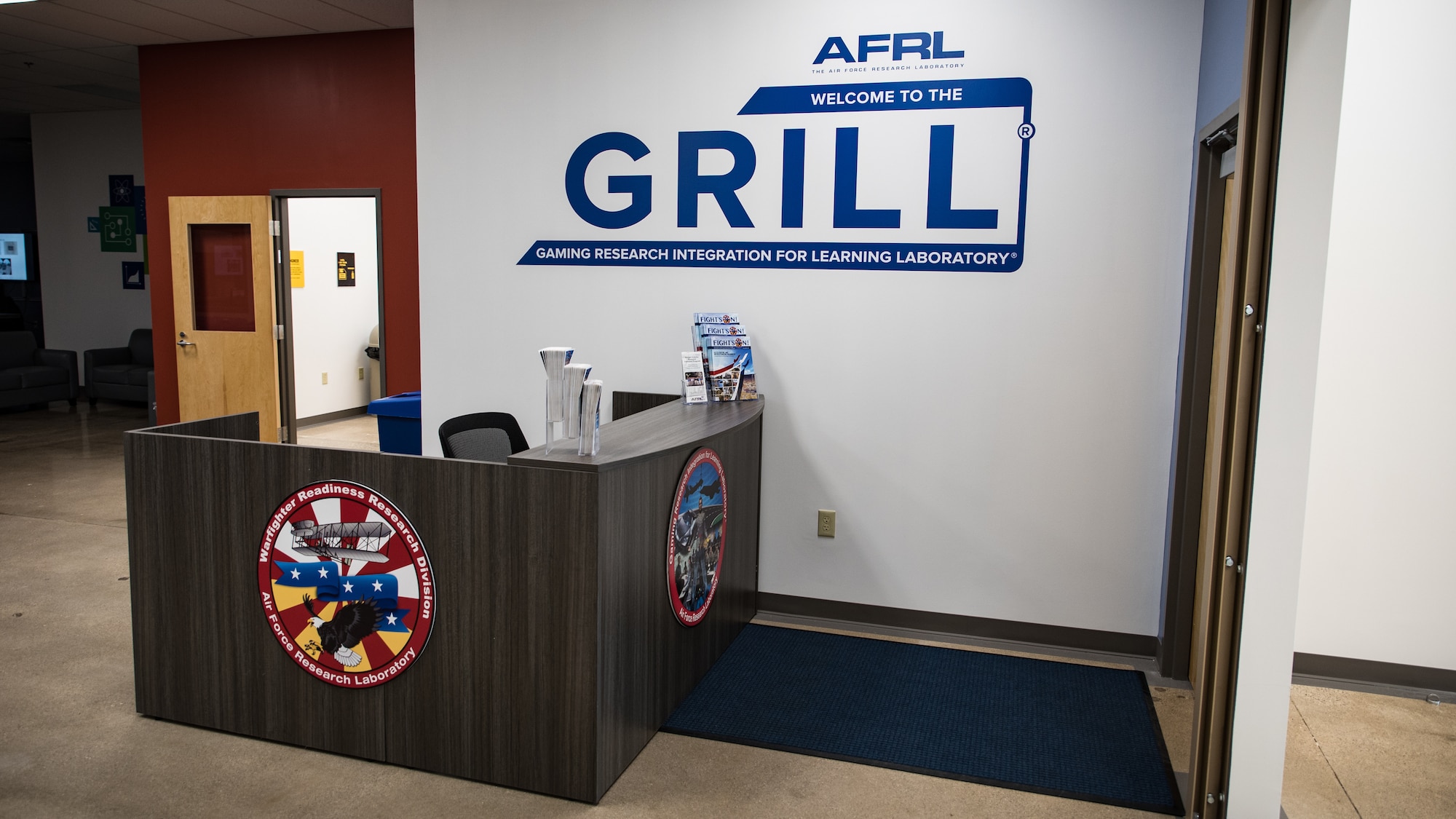 The front desk and entrance of the new Air Force Research Laboratory’s Gaming Research Integration and Learning Laboratory (GRILL) was shown to attendees after the ribbon-cutting ceremony at the Dayton Regional STEM School June 7. (U.S. Air Force photo/Richard Eldridge)