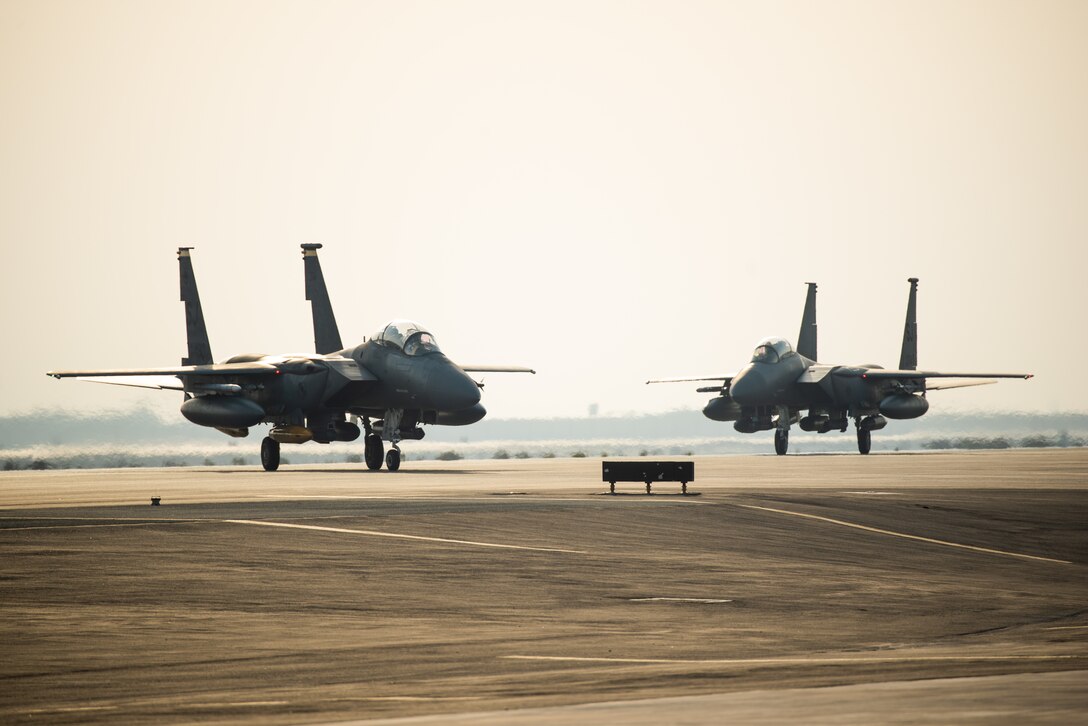 Two F-15E Strike Eagles from the 336th Fighter Squadron, 4th Fighter Wing at Seymour Johnson Air Force Base, North Carolina taxi the runway at Al Dhafra Air Base, United Arab Emirates, June 13, 2019. The F-15E’s joined ADABs inventory of other fighters to include F-15C Eagles and F-35A Lightning IIs. (U.S. Air Force photo by Staff Sgt. Chris Thornbury)