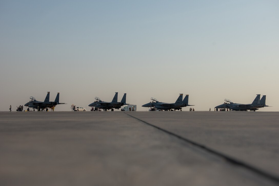 Four F-15E Strike Eagles from the 336th Fighter Squadron, 4th Fighter Wing at Seymour Johnson Air Force Base, North Carolina sit on the airfield at Al Dhafra Air Base, United Arab Emirates, June 13, 2019. The F-15E’s joined ADABs inventory of other fighters to include F-15C Eagles and F-35A Lightning IIs. (U.S. Air Force photo by Staff Sgt. Chris Thornbury)