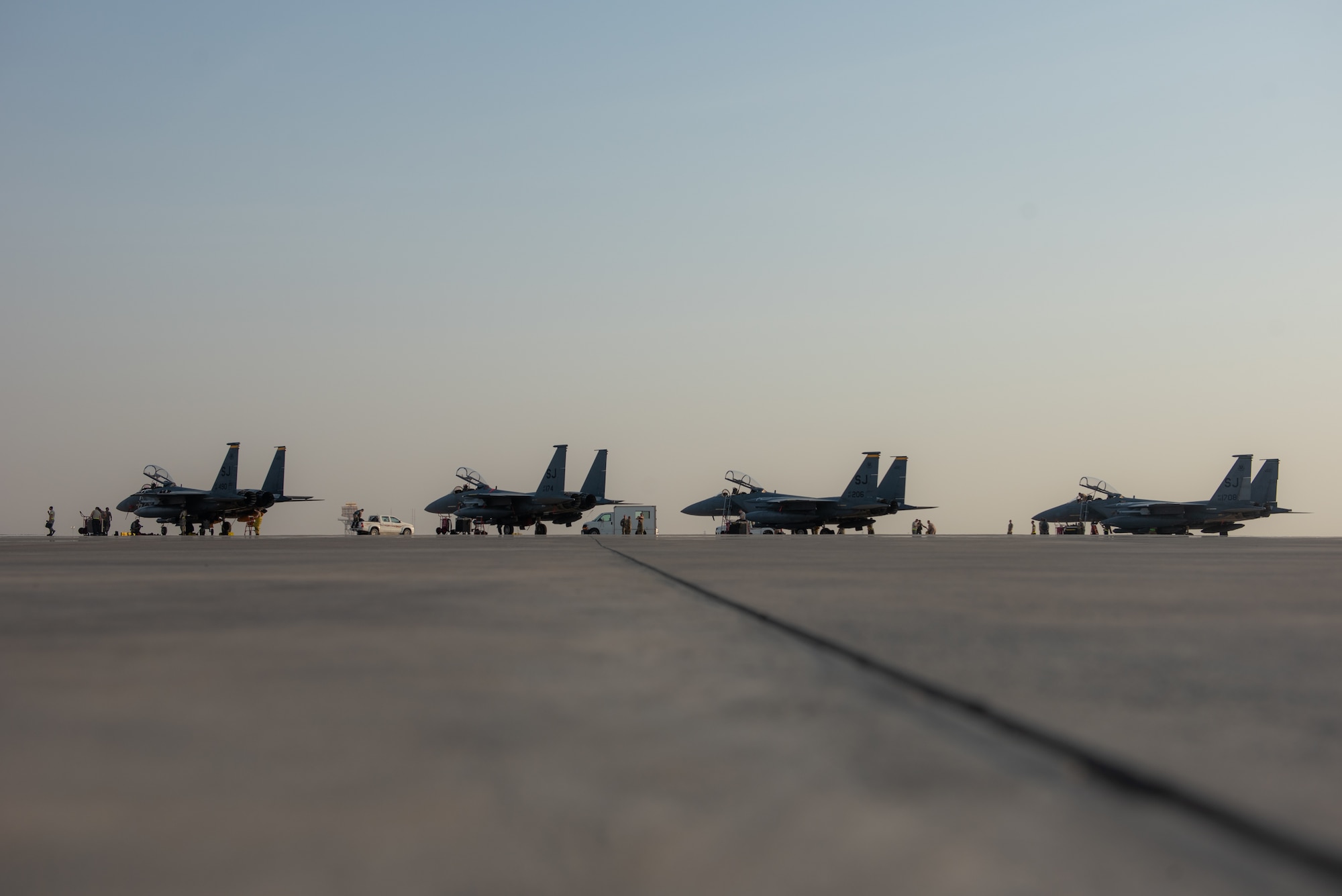 Four F-15E Strike Eagles from the 336th Fighter Squadron, 4th Fighter Wing at Seymour Johnson Air Force Base, North Carolina sit on the airfield at Al Dhafra Air Base, United Arab Emirates, June 13, 2019. The F-15E’s joined ADABs inventory of other fighters to include F-15C Eagles and F-35A Lightning IIs. (U.S. Air Force photo by Staff Sgt. Chris Thornbury)
