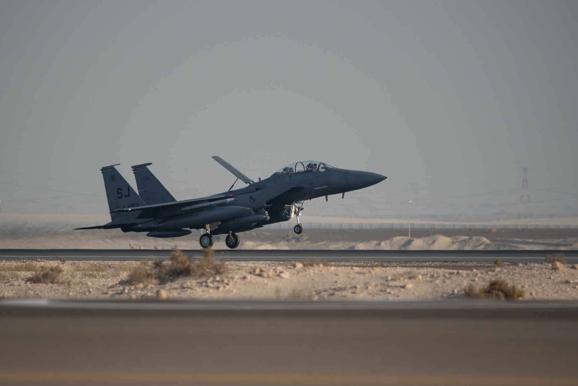 An F-15E Strike Eagle deployed from the 4th Fighter Wing at Seymour Johnson Air Force Base, North Carolina, lands at Al Dhafra Air Base, United Arab Emirates, June 14, 2019. F-15E’s are designed to perform in air-to-air and air-to ground operations in any environment. (U.S. Air Force photo by Staff Sgt. Chris Thornbury)