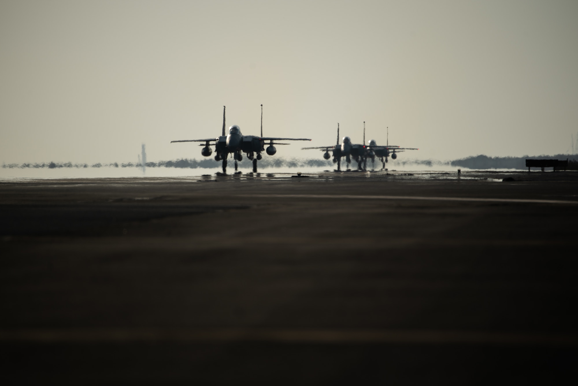 Three F-15E Strike Eagles from the 336th Fighter Squadron, 4th Fighter Wing at Seymour Johnson Air Force Base, North Carolina taxi the runway at Al Dhafra Air Base, United Arab Emirates, June 14, 2019. The F-15E’s joined ADABs inventory of other fighters to include F-15C Eagles and F-35A Lightning IIs. (U.S. Air Force photo by Staff Sgt. Chris Thornbury)