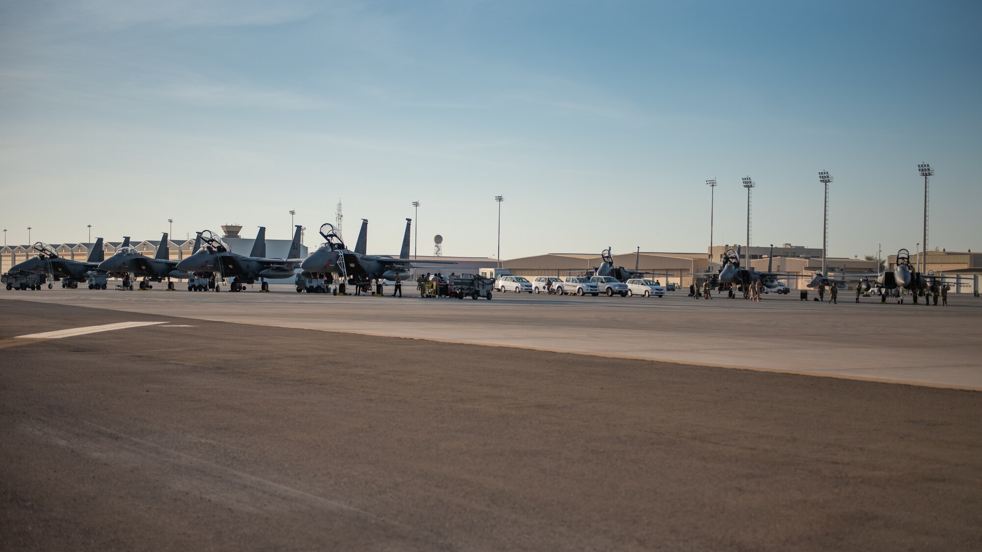 Seven F-15E Strike Eagles from the 336th Fighter Squadron, 4th Fighter Wing at Seymour Johnson Air Force Base, North Carolina sit on the airfield at Al Dhafra Air Base, United Arab Emirates, June 14, 2019. The F-15E’s joined ADABs inventory of other fighters to include F-15C Eagles and F-35A Lightning IIs. (U.S. Air Force photo by Staff Sgt. Chris Thornbury)