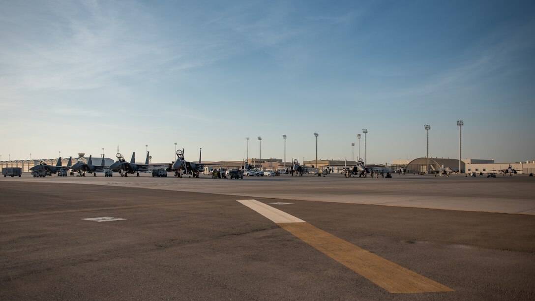 Seven F-15E Strike Eagles from the 336th Fighter Squadron, 4th Fighter Wing at Seymour Johnson Air Force Base, North Carolina sit on the airfield at Al Dhafra Air Base, United Arab Emirates, June 14, 2019. The F-15E’s joined ADABs inventory of other fighters to include F-15C Eagles and F-35A Lightning IIs. (U.S. Air Force photo by Staff Sgt. Chris Thornbury)