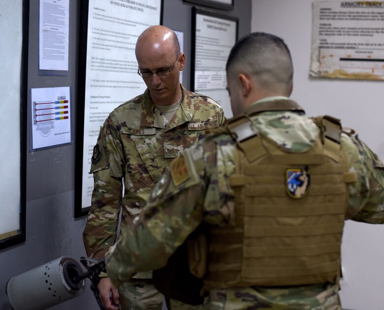 Tech. Sgt. Jones, 39th Security Forces Squadron Delta Flight sergeant, observes an Airman clearing his weapon before guard mount April 4, 2019, at Incirlik Air Base, Turkey. The 39th SFS Airmen perform these safety checks after receiving their weapon and before turning it back in to ensure it is safe to handle. (U.S. Air Force photo by Staff Sgt. Trevor Rhynes)