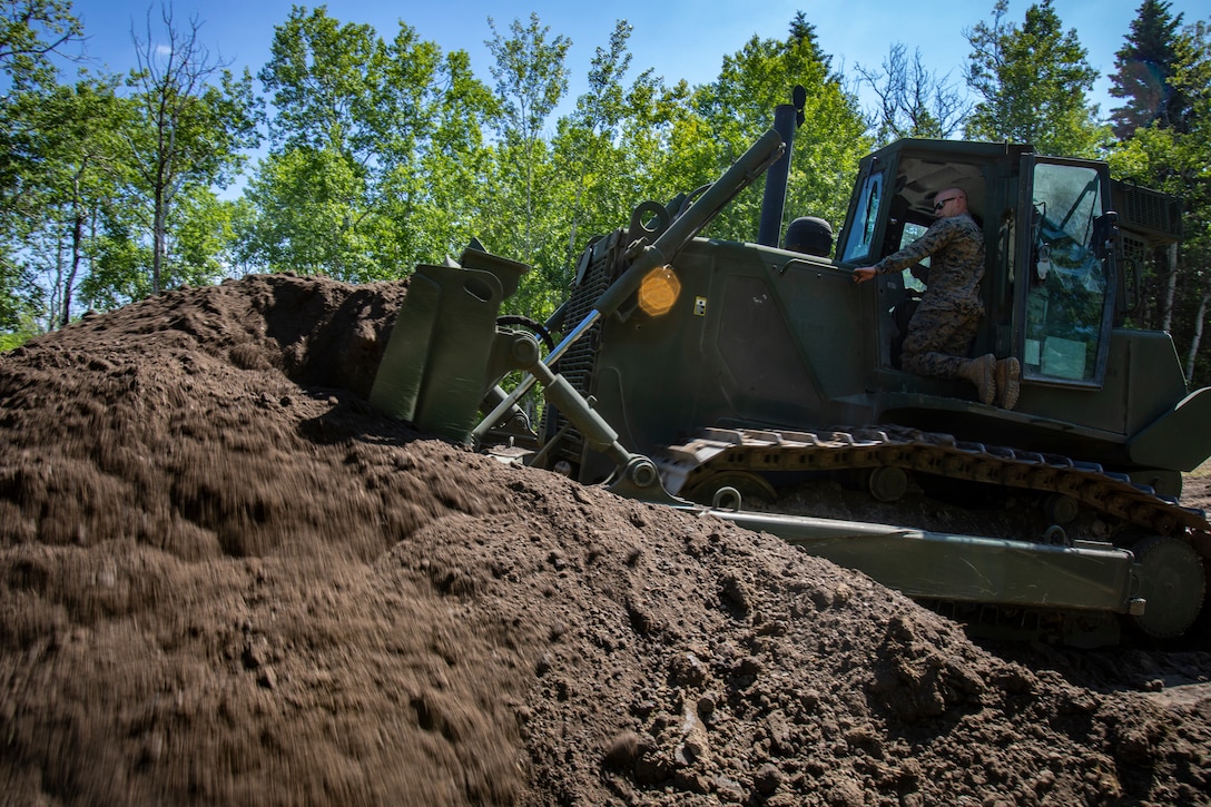 U.S. Marines with MWSS-471 build a roadway at Canadian Forces Base Cold Lake