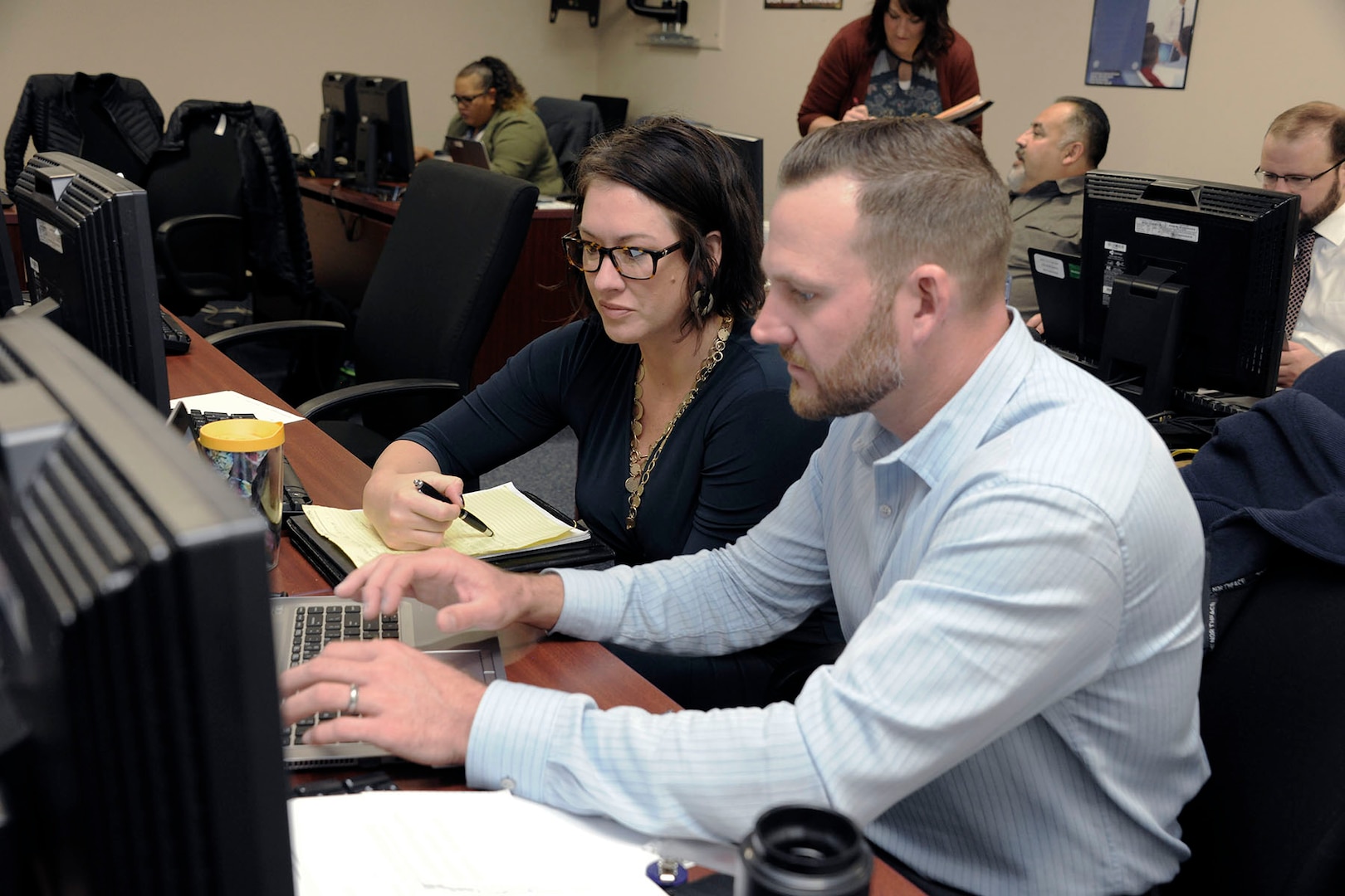 Amber Gentry-Upston, HAZMAT program manager for DLA Information Operations, works with a user during the testing.