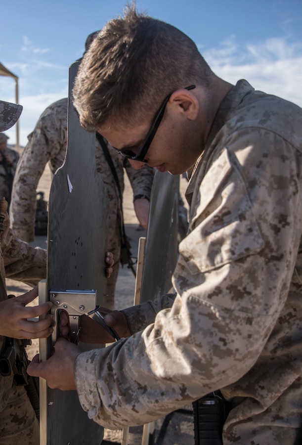 A U.S. Marine with Marine Wing Support Squadron 472, Marine Aircraft Group 49, 4th Marine Aircraft Wing prepares targets on Range 106 during Integrated Training Exercise 4-19 at Marine Corps Air Ground Combat Center Twentynine Palms, Calif., June 13, 2019. ITX measures the ability to provide a cohesive, trained and ready capability in support of service and Combatant Commander requirements. (U.S. Marine Corps photo by Cpl. Tessa D. Watts)