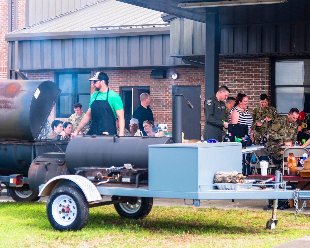 Donnie Ferneau, 913th Airlift Group honorary commander and renowned chef, grills barbeque for Reserve Citizen Airmen who recently returned from a deployment on May 20, 2019 at Little Rock Air Force Base, Ark.