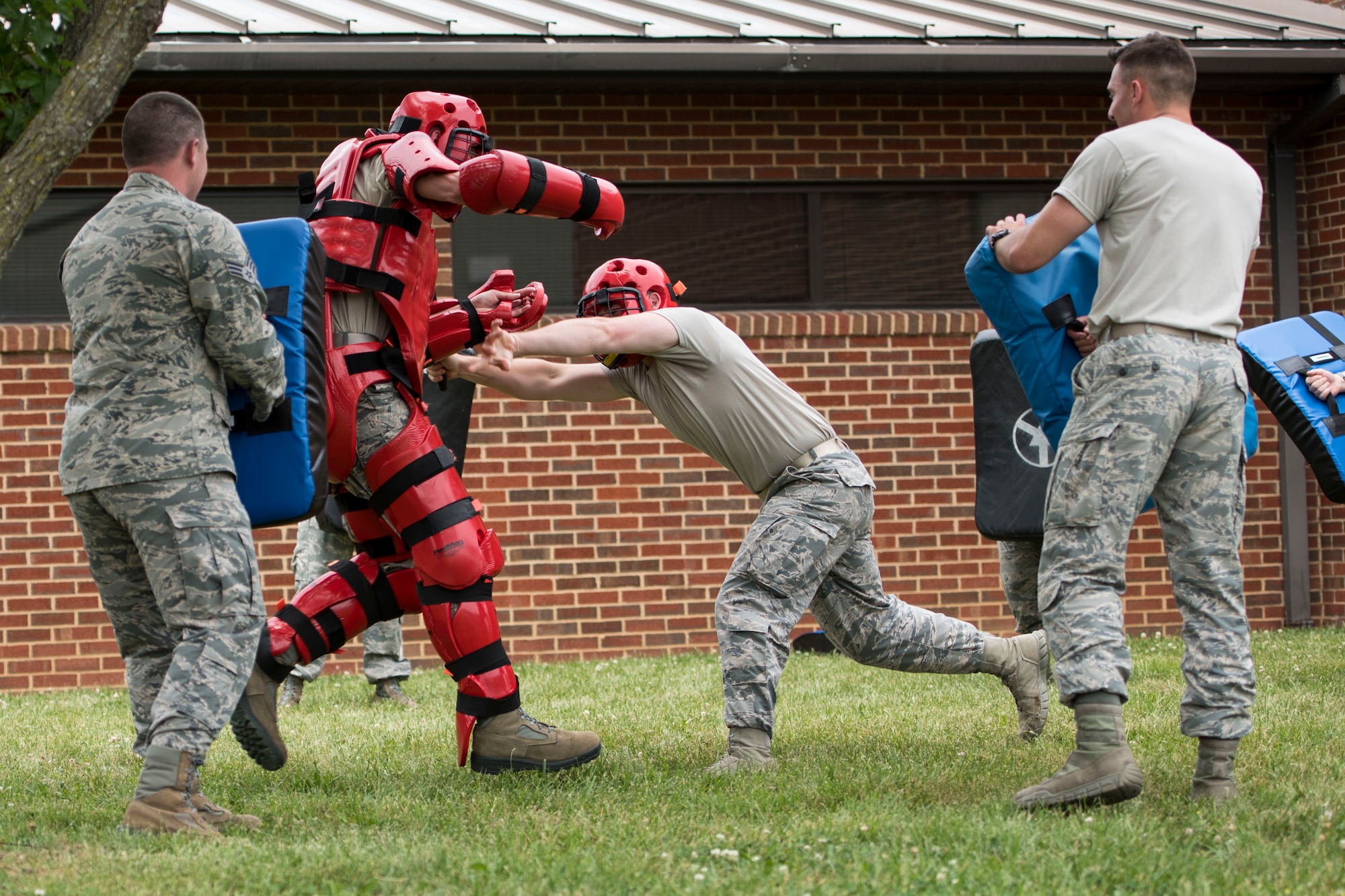 Members of the 167th Security Forces participated in “Redman” training in front of the dining facilityat the 167th Airlift WIng, martinsburg, W.Va.,  June 7, 2019. During the training, security forces members practiced striking and blocking against the “Redman.” (U.S. Air National Guard photo by Tech. Sgt. Jodie Witmer)