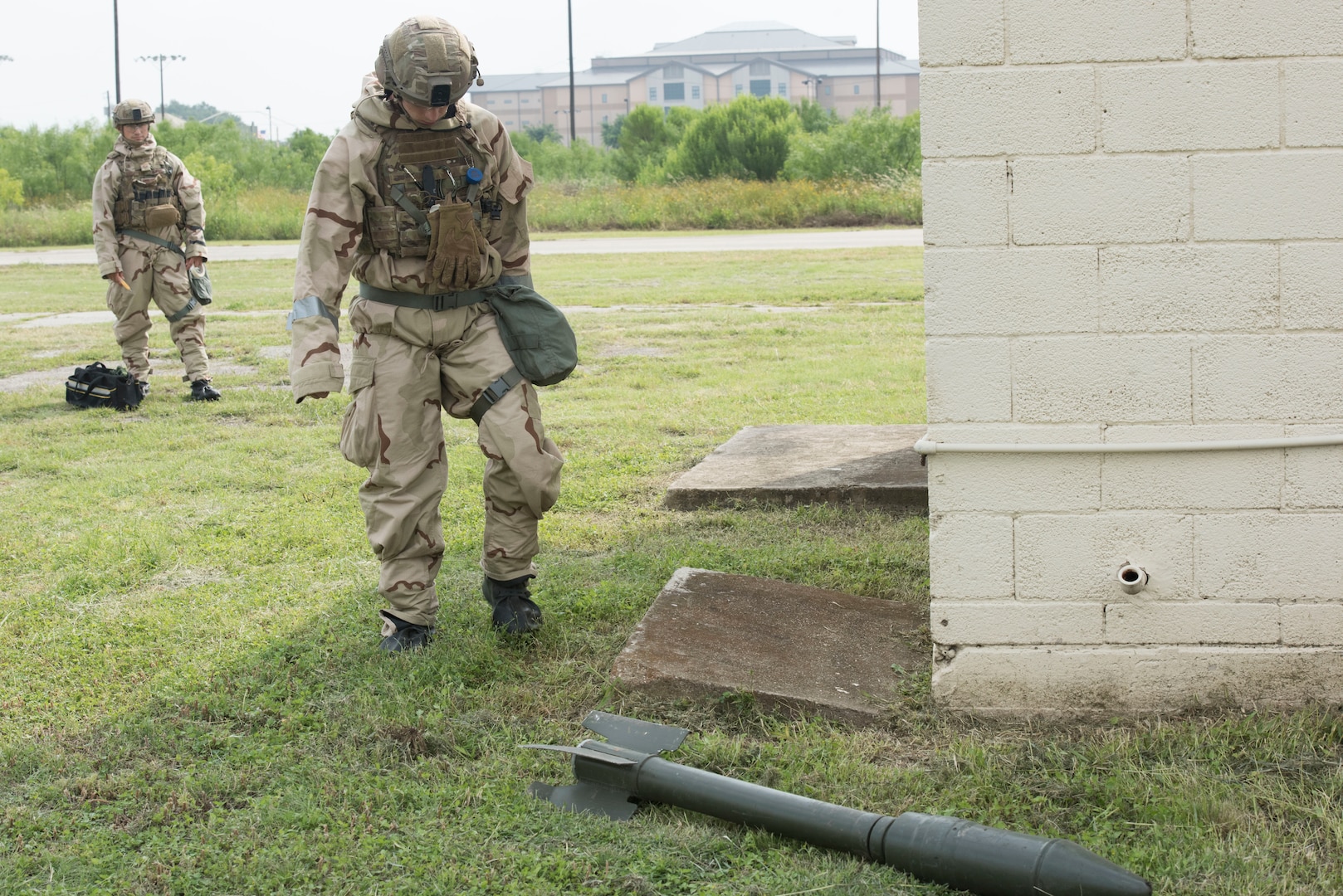 Staff Sgt. Brandon Foster and Staff Sgt. Eli Marquez, 902nd Civil Engineer Squadron Explosive Ordinance Disposal team leaders, practices disarming chemical munitions May 17, 2019, at Joint Base San Antonio-Lackland, Texas. EOD team members are Trained to detect, disarm, detonate and dispose of explosive threats.