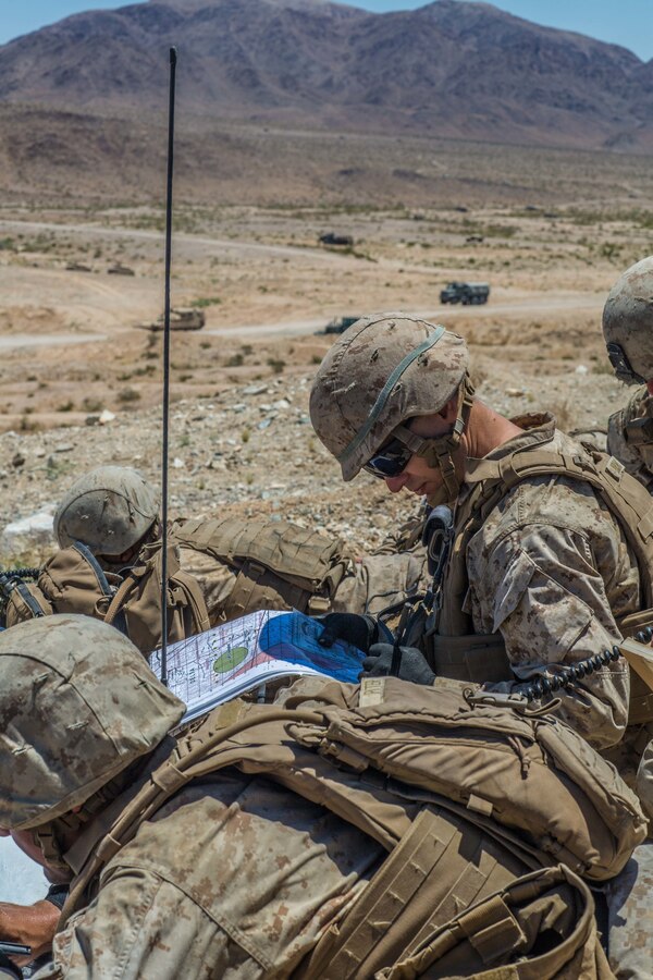 U.S. Marine forward observers attached from I Battery, 3rd Battalion, 14th Marine Regiment, 4th Marine Division, call for fire during the mechanized assault course during Integrated Training Exercise 4-19 at Marine Corps Air Ground Combat Center, Twentynine Palms, Calif., June 12, 2019. The ITX force includes each of the Marine Air-Ground Task Force’s subordinate elements who work together in the application of combined-arms maneuver warfare during the exercise. (U.S. Marine Corps photo by Lance Cpl. Preston L. Morris)