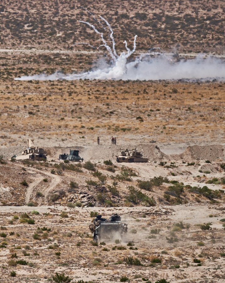 An assault amphibious vehicle with 4th Assault Amphibian Battalion, 4th Marine Division, moves up toward a breached obstruction during the mechanized assault course of Integrated Training Exercise 4-19 at Marine Corps Air Ground Combat Center, Twentynine Palms, Calif., June 12, 2019. The ITX force includes each of the Marine Air-Ground Task Force’s subordinate elements who work together in the application of combined-arms maneuver warfare during the exercise. (U.S. Marine Corps photo by Master Sgt. Robert Brown)