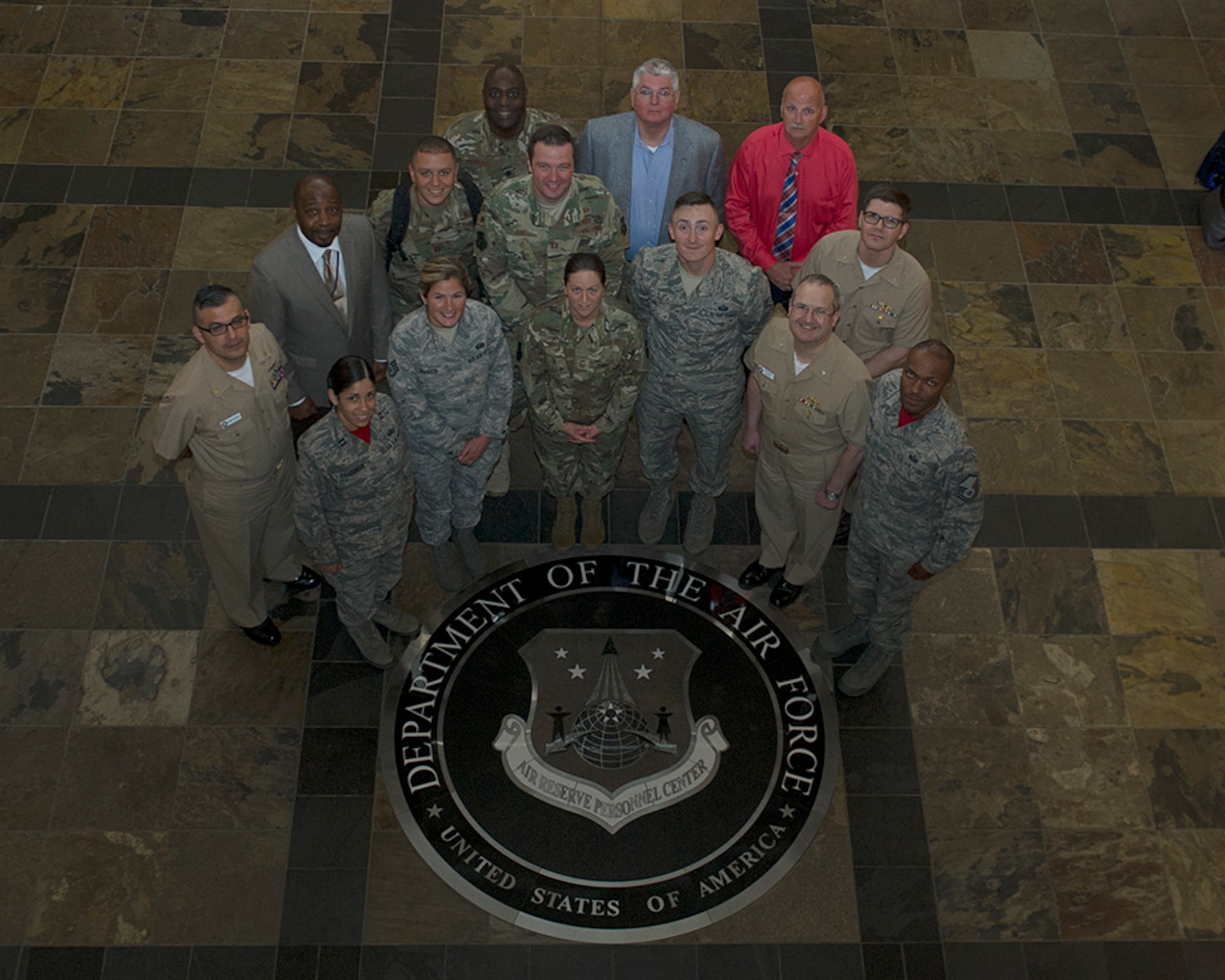Joint service members and civilians pose for a group photo during Day Two of the 2019 Joint Individual Ready Reserve Conference, hosted by HQ Air Reserve Personnel Center, Buckley Air Force Base, Colorado, June 13-15, 2019.