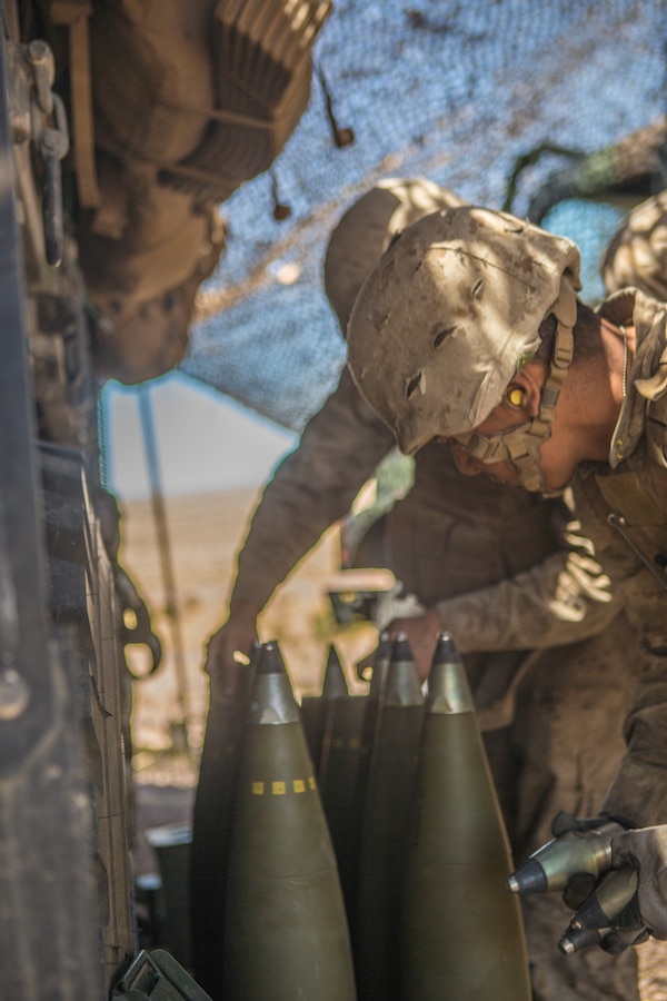 U.S. Marines with November Battery, 5th Battalion, 14th Marine Regiment, 4th Marine Division, prepare 155mm artillery shells for a fire mission at Gays Pass during Integrated Training Exercise 4-19 at the Marine Corps Air Ground Combat Center, Twentynine Palms, Calif., June 14, 2019. The ITX force includes each of the Marine Air-Ground Task Force’s subordinate elements who work together in the application of combined-arms maneuver warfare during the exercise. (U.S. Marine Corps photo by Lance Cpl. Preston L. Morris)