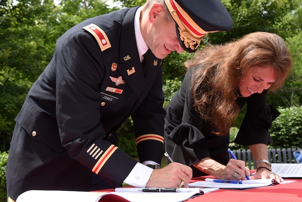 Lt. Col. Cullen Jones, U.S. Army Corps of Engineers Nashville District commander, and Mayor Paige Brown sign a project partnership agreement June 14, 2019 in Gallatin, Tenn., which clears the way for the Corps to begin the design and implementation phase for a flood risk reduction project to help alleviate flooding during periods of heavy rain. (USACE photo by Lee Roberts)