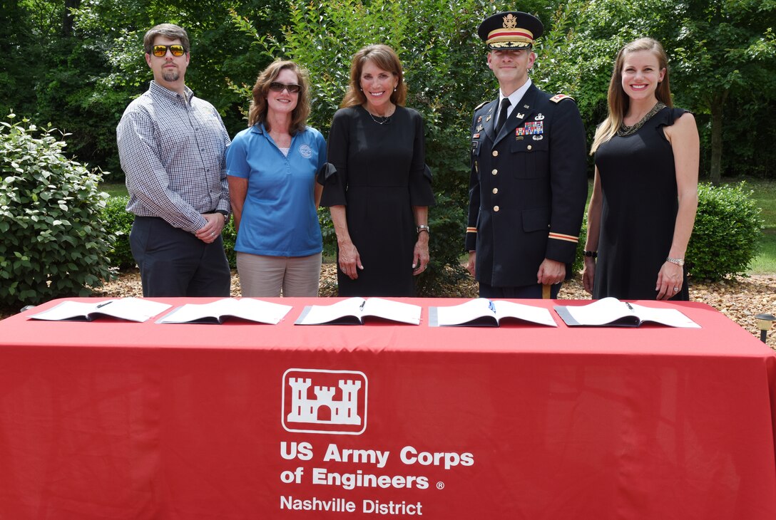 (Left to Right) Lance Wagner, Gallatin Stormwater Utility manager; Jennifer Watson, Gallatin Stormwater coordinator; Gallatin Mayor Paige Brown; Lt. Col. Cullen Jones, U.S. Army Corps of Engineers Nashville District commander; and Lacey Thomason, Nashville District project manager; participate in a project partnership agreement signing June 14, 2019 at Triple Creek Park in Gallatin, Tenn. The agreement clears the way for the Corps of Engineers to enter into the design and implementation phase for a flood risk reduction project to help alleviate flooding during periods of heavy rain. (USACE photo by Lee Roberts)