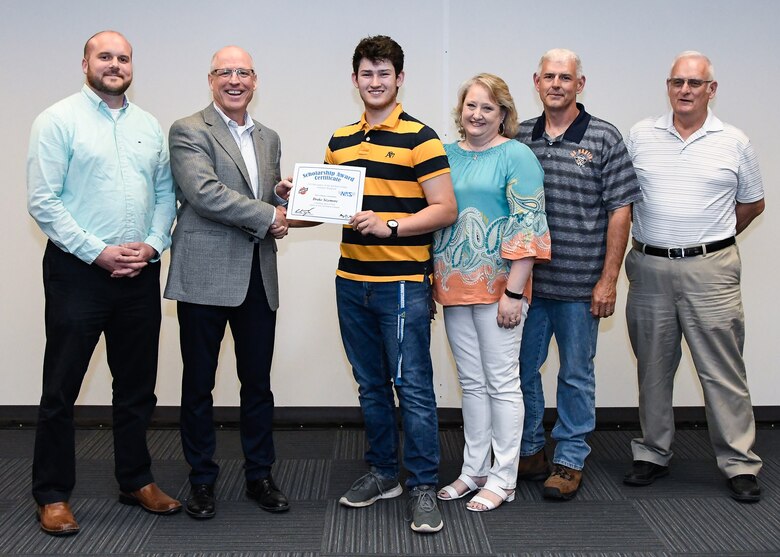 Dr. Rich Tighe, second from left, general manager of the Test Operations and Sustainment contractor at Arnold Air Force Base, presents a certificate to Drake Sizemore recognizing him as one of the 2019 Bechtel Global Scholars during a meeting May 31 at Arnold. Also pictured, from left, are NAS Business Services Director Jon Ragan; Drake's parents, Darbie and Billy Sizemore, who are NAS employees; and Drake's grandfather Henry Sizemore, also a NAS employee. Drake will receive a $3,000 scholarship funded by the Bechtel Group Foundation for his first year of study at an accredited institution. (U.S. Air Force photo by Jill Pickett)