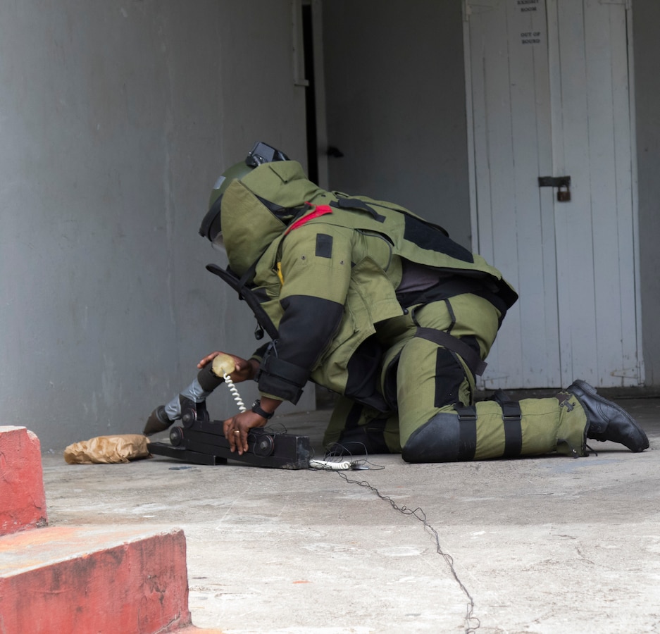 Petty Officer Damien Franklin, St. Vincent and the Grenadines Coast Guard, disables a simulated improvised explosive device (IED) during disaster response training.