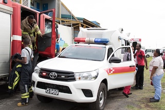 Medical and fire department personnel at Saint Vincent and the Grenadines respond to a simulated shooting training exercise.