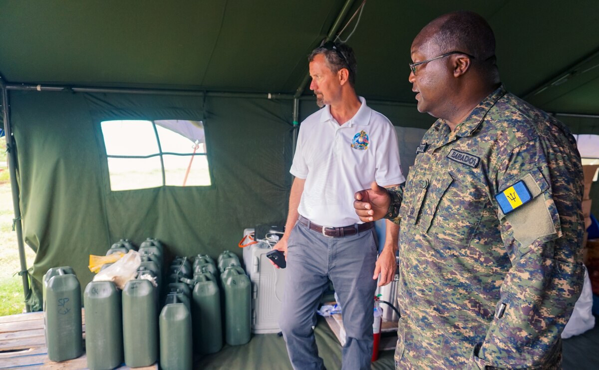 Major J. Browne from the Barbados Defence Force shows the Role 1 field hospital to Mr. Douglas Fitzgerald from United States Southern Command.