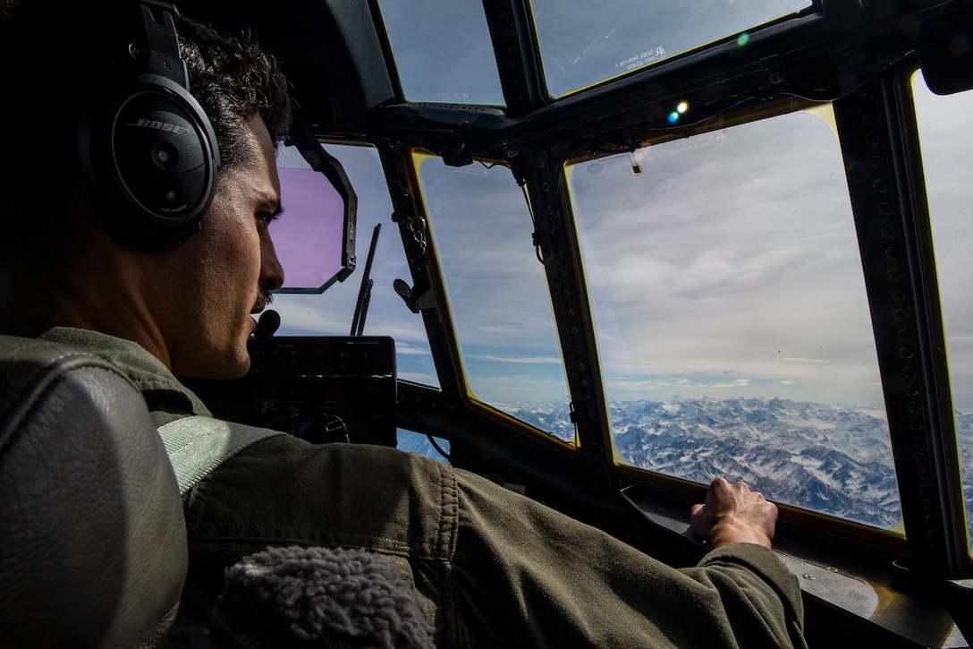 U.S. Marine Corps Capt. Anthony Gutierrez, a KC-130J Super Hercules pilot with Marine Aerial Refueler Transport Squadron 152, observes the terrain of the Joint Pacific Alaska Range Complex during  Exercise Kodiak Mace, Alaska, May 25, 2019. VMGR-152 provides additional flexibility for III Marine Expeditionary Force, enhancing a forward-deployed “ready force” in the Indo-Pacific through aerial refueling and assault support.